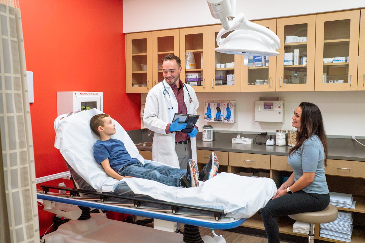 Mother and son with provider at AFC Urgent Care